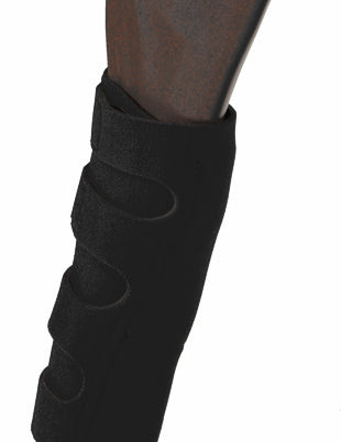 A black Jacks Neoprene 6 Pocket Ice Boot on a fake horse's leg on a white background