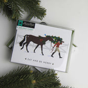 Front view of the Eat & Be Merry Hunt Seat Paper Co. Holiday Card in its packaging