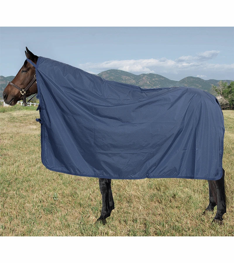 Side view of a horse wearing the Navy Jacks Rain Cover white standing in a pasture outside