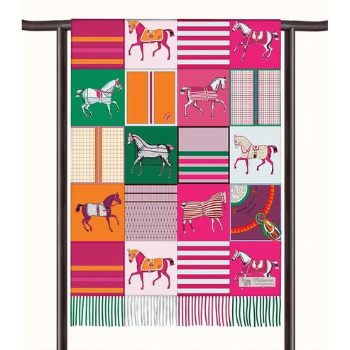 View of the Pink AWST Int'l Horses in Blankets Cashmere Scarf draped over a rod on a white background