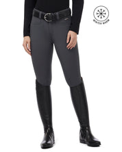 Front view of a female model wearing the Carbon Kerrits 3-Season Tailored Knee Patch Breech on a plain background