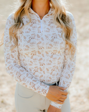 Front view of a female model wearing the Deinhardt Designs Impulsion & Straightness Lori Long Sleeve Signature Sunshirt while standing outside