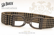 Full view of the Baker Plaid Copper Ellany Elastic Stirrup Belt on a white background with decorative accents and text "Feel the history. Love the look."