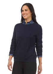 Front view of a female model wearing the Galaxy Blue Kerrits Bit of Diamond Crewneck Sweater on a plain background