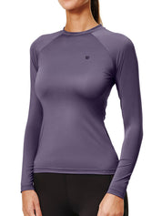 Front view of a female model wearing the Dark Violey Equestrian Stockholm Dynamic Long Sleeve Base Layer on a white background
