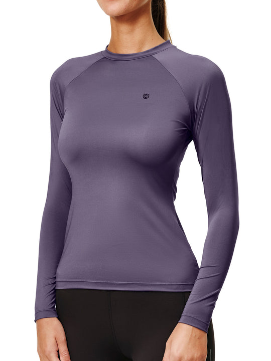 Front view of a female model wearing the Dark Violey Equestrian Stockholm Dynamic Long Sleeve Base Layer on a white background
