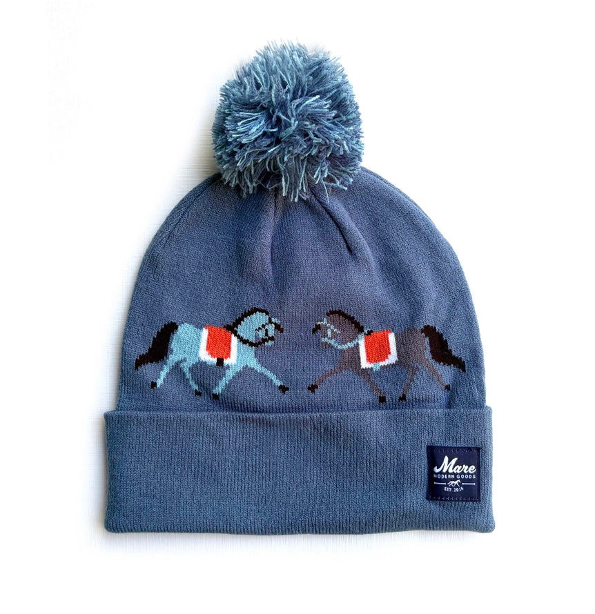Front view of the Dressage Ponies Mare Modern Goods Pom Beanie on a white background