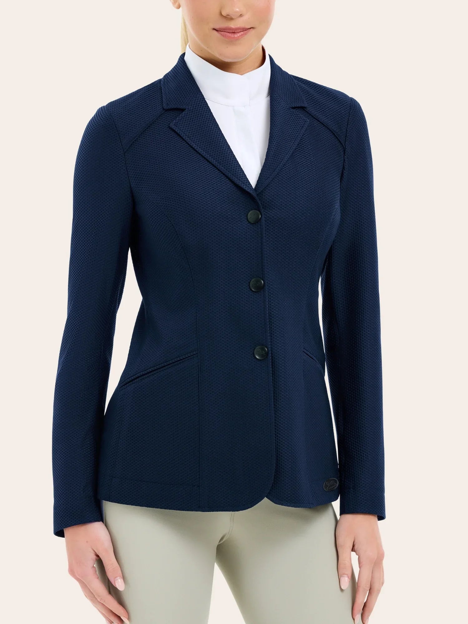 Angled front view of a female model wearing the navy RJ Classic Addison Air Mesh Coat on a plain background