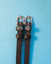 View of the Aquarius Mane Jane Spur Straps on a blue background
