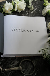 View of the title page of the Stable Style Book-Volume III on a marble and flower background