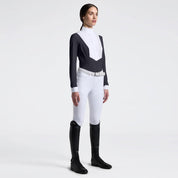 Angled front view of a female model wearing the Charcoal Cavalleria Toscana American Long Sleeve Competition Shirt on a plain background