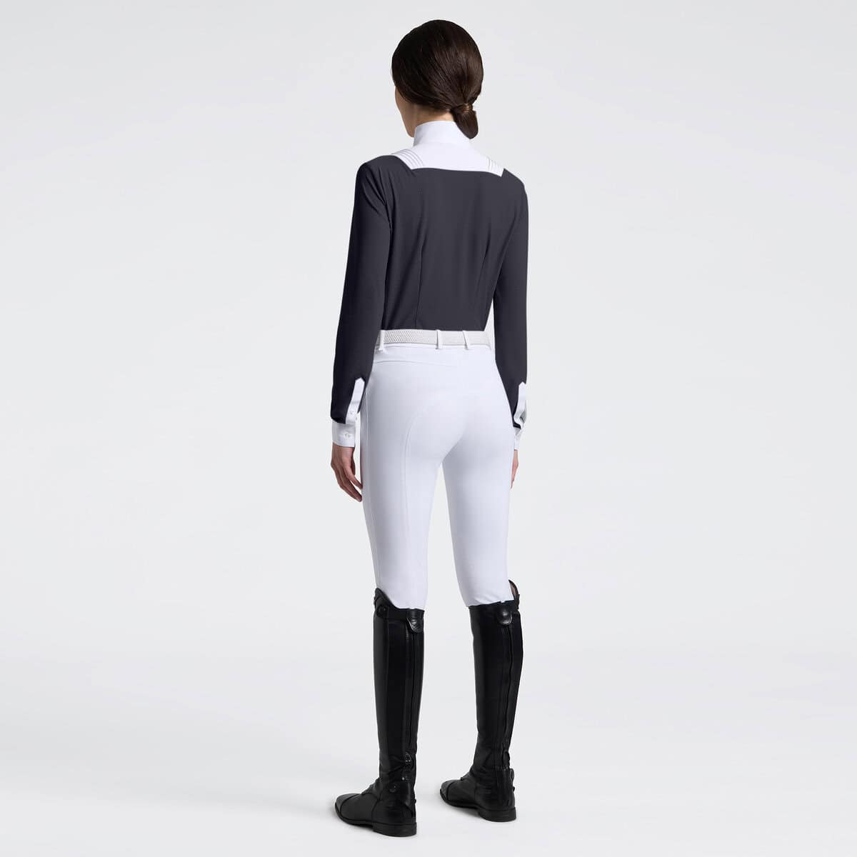 Back view of a female model wearing the Charcoal Cavalleria Toscana American Long Sleeve Competition Shirt on a plain background