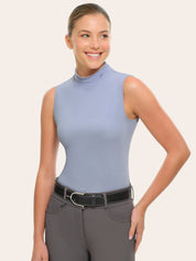 Front view of a female model wearing the blue RJ Classics Corrie Mock Neck Shirt on a white background