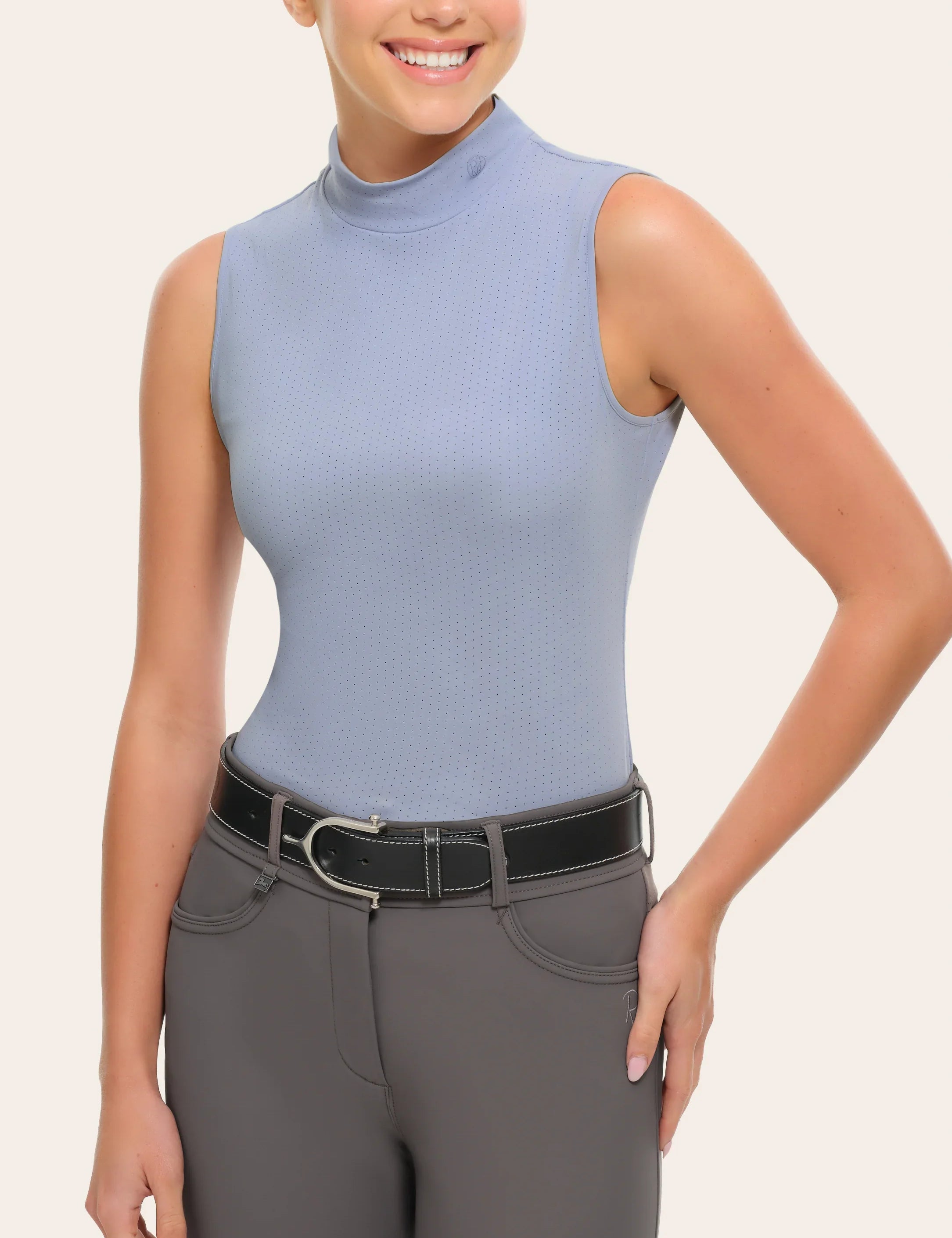 Front view of a female model wearing the blue RJ Classics Corrie Mock Neck Shirt on a white background
