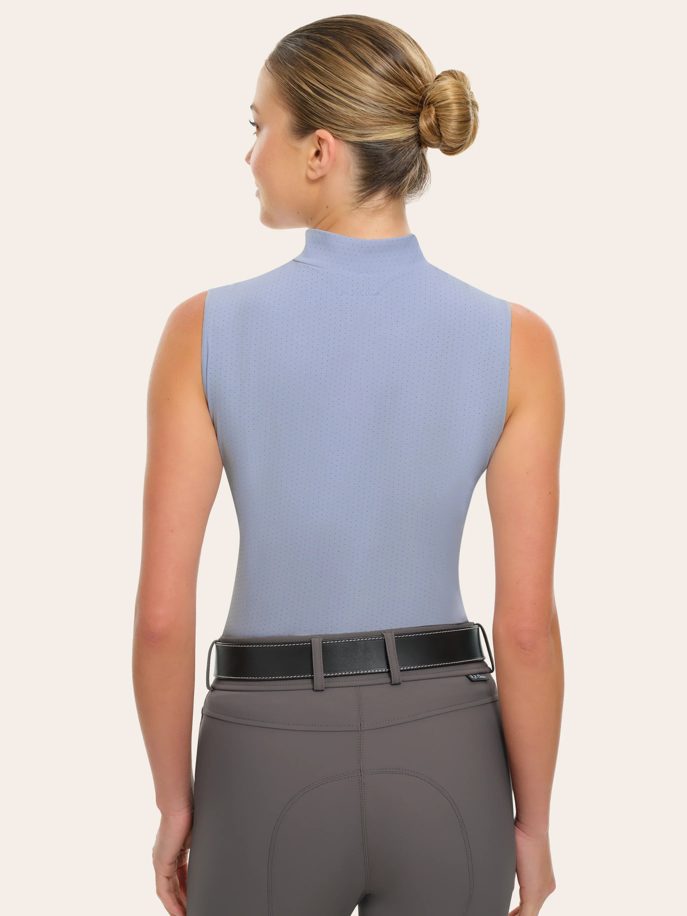 Back view of a female model wearing the blue RJ Classics Corrie Mock Neck Shirt on a white background