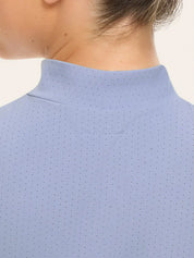 Back view of a female model wearing the blue RJ Classics Corrie Mock Neck Shirt on a white background