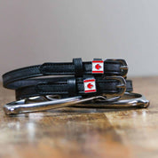 View of the Canadian flag Mane Jane Spur Straps on a wood table background