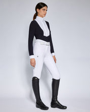 Angled front view of a female model wearing the Black Cavalleria Toscana American Long Sleeve Competition Shirt on a plain background