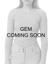 Coming Soon Infographic with the front view of a female model wearing the Gem TKEQ Kennedy Seamless Long Sleeve Shirt 2.0 on a white background