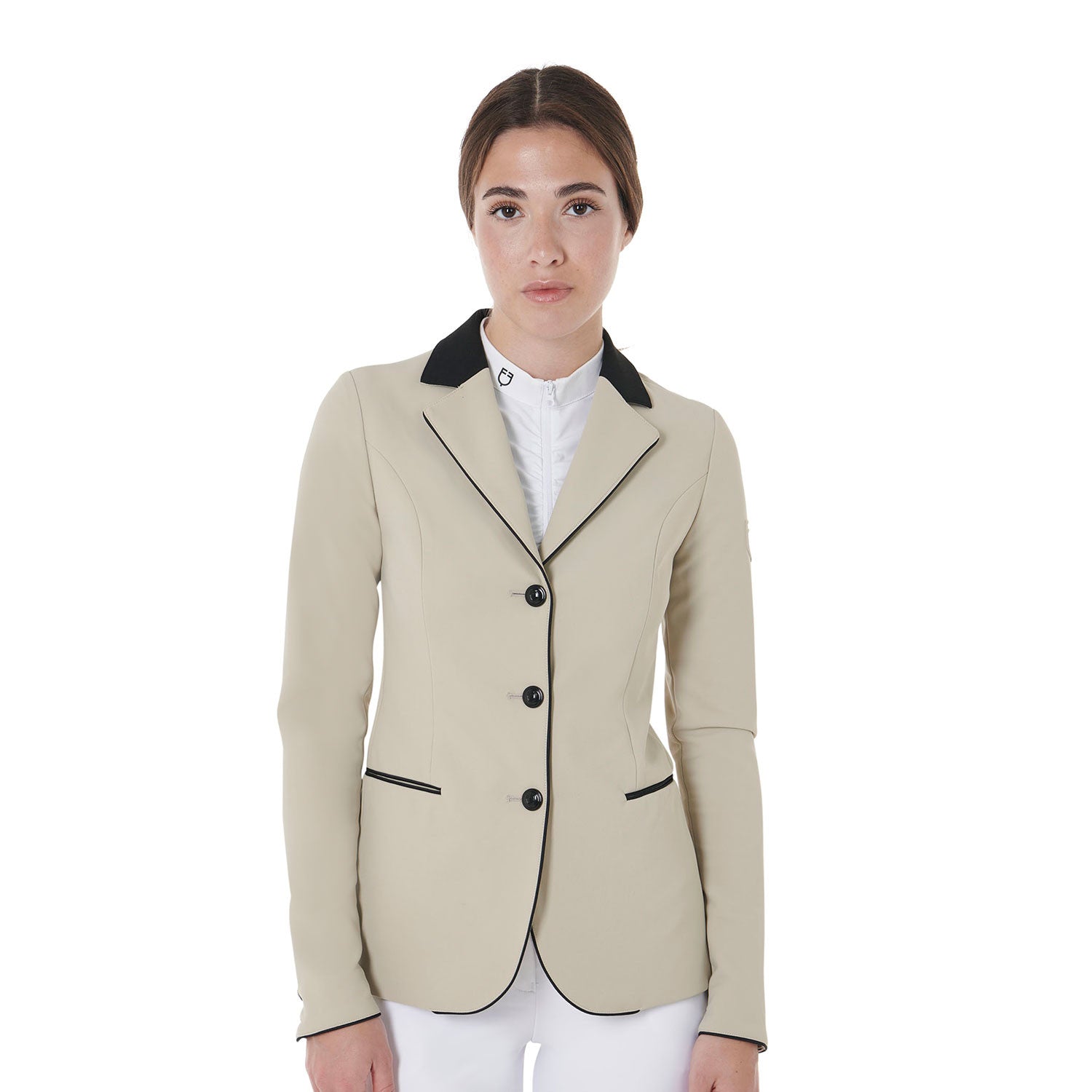 Front view of model wearing the Equestro Women's Three-Button Competition Jacket in tan on a white background