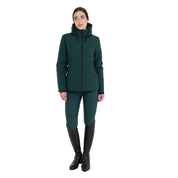 Full body front view of a female model wearing the Pine Grove Equestro Water & Wind Repellent Down Jacket with green breeches on a plain background
