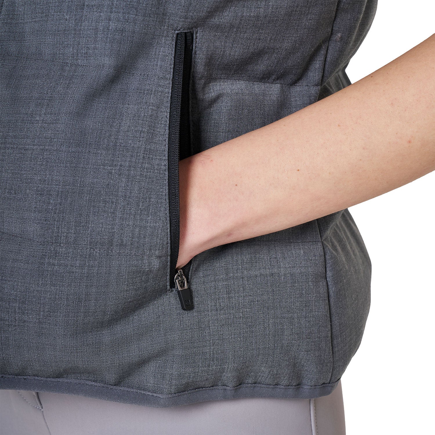 Close-up view of the zipper pocket on the Grey Melange Equestro Quilted Wool Vest as worn by a female model