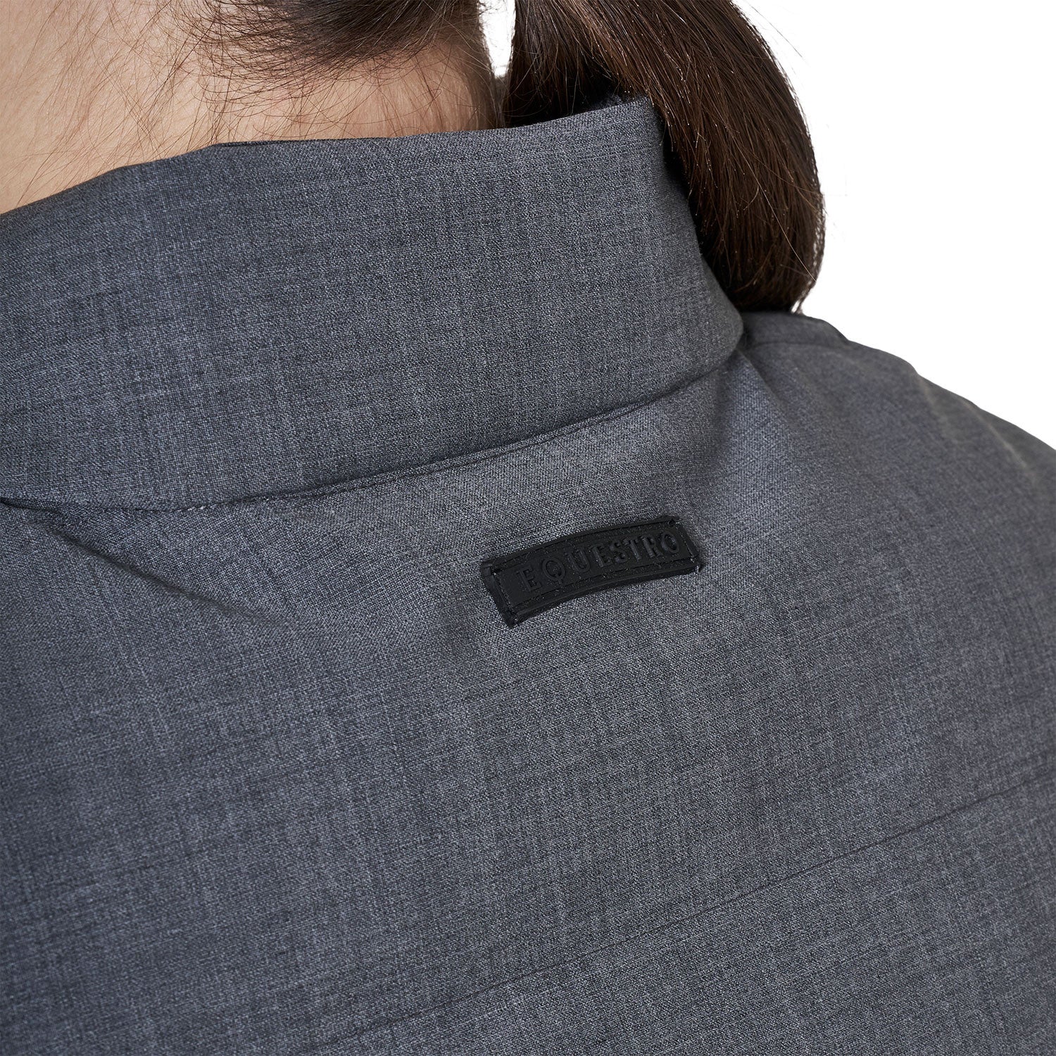 Close-up view of the Equestro name on the Grey Melange Equestro Quilted Wool Vest on a plain background as worn by a female model