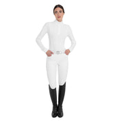 Full body front view of a female model wearing the White Equestro Perforated Long-Sleeve Competition Polo Shirt with white breeches on a plain background