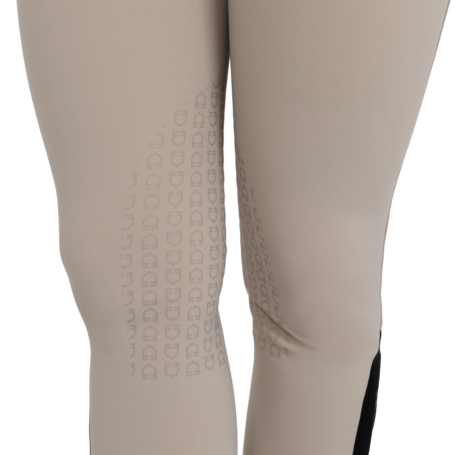 Close-up view of the silicone grip on the Cobblestone Equestro High-Waisted Knee Grip Breeches on a plain background