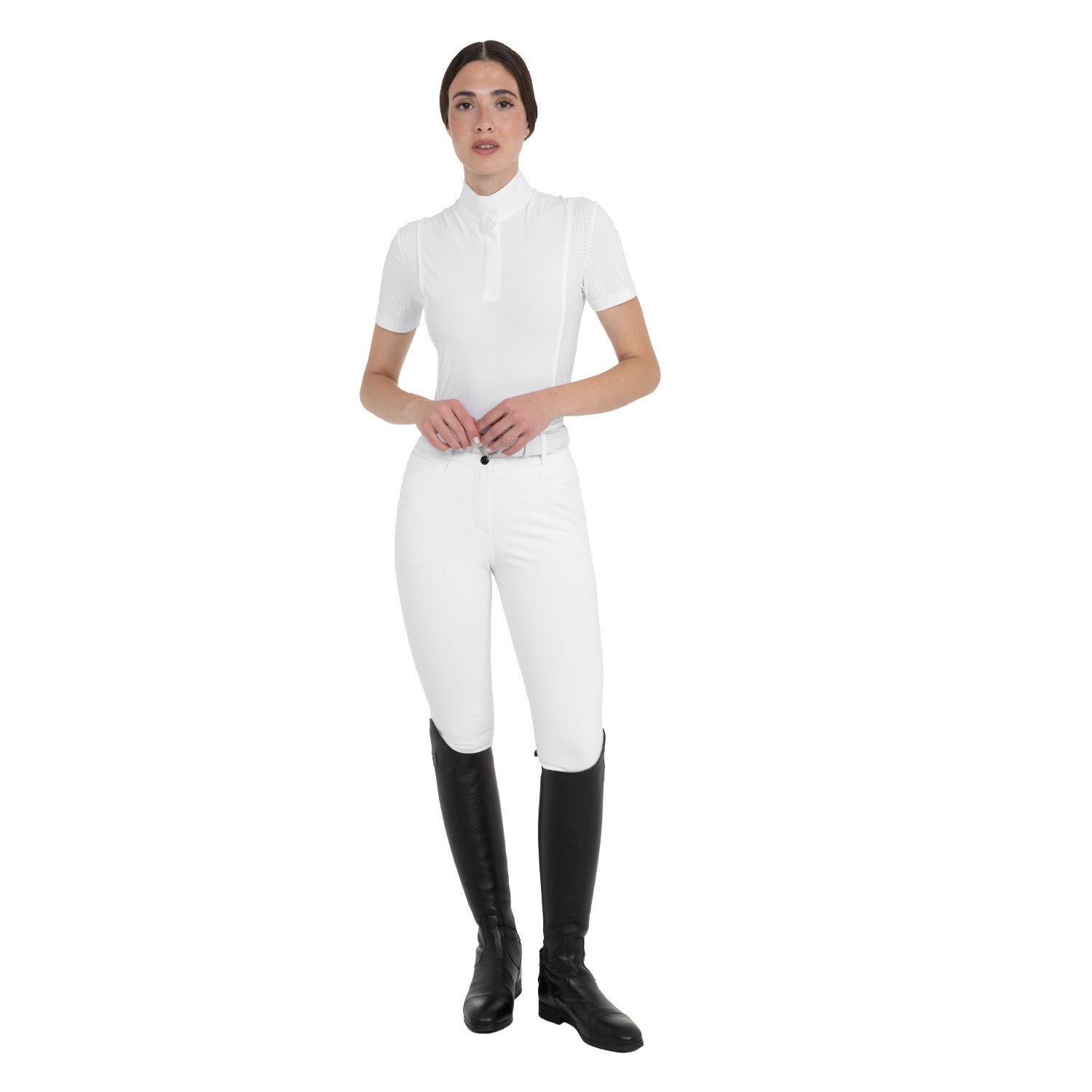 Full body front view of a female model wearing the White Equestro High-Waisted Full Grip Breeches with white shirt on a plain background