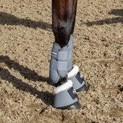 View of horse wearing a pair of Charcoal Professional's Choice Performance Elite Cross Country Front Boots while standing in the dirt