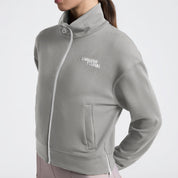 Angled front view of a model wearing the Cavalleria Toscana Jersey Zip Sweatshirt in the color Belgian Block