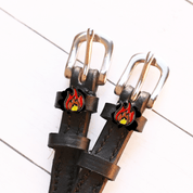 View of the Flame Mane Jane Spur Straps  on a white shiplap background