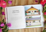 View of an open Stable Style Book-Volume I on a wood and flower background