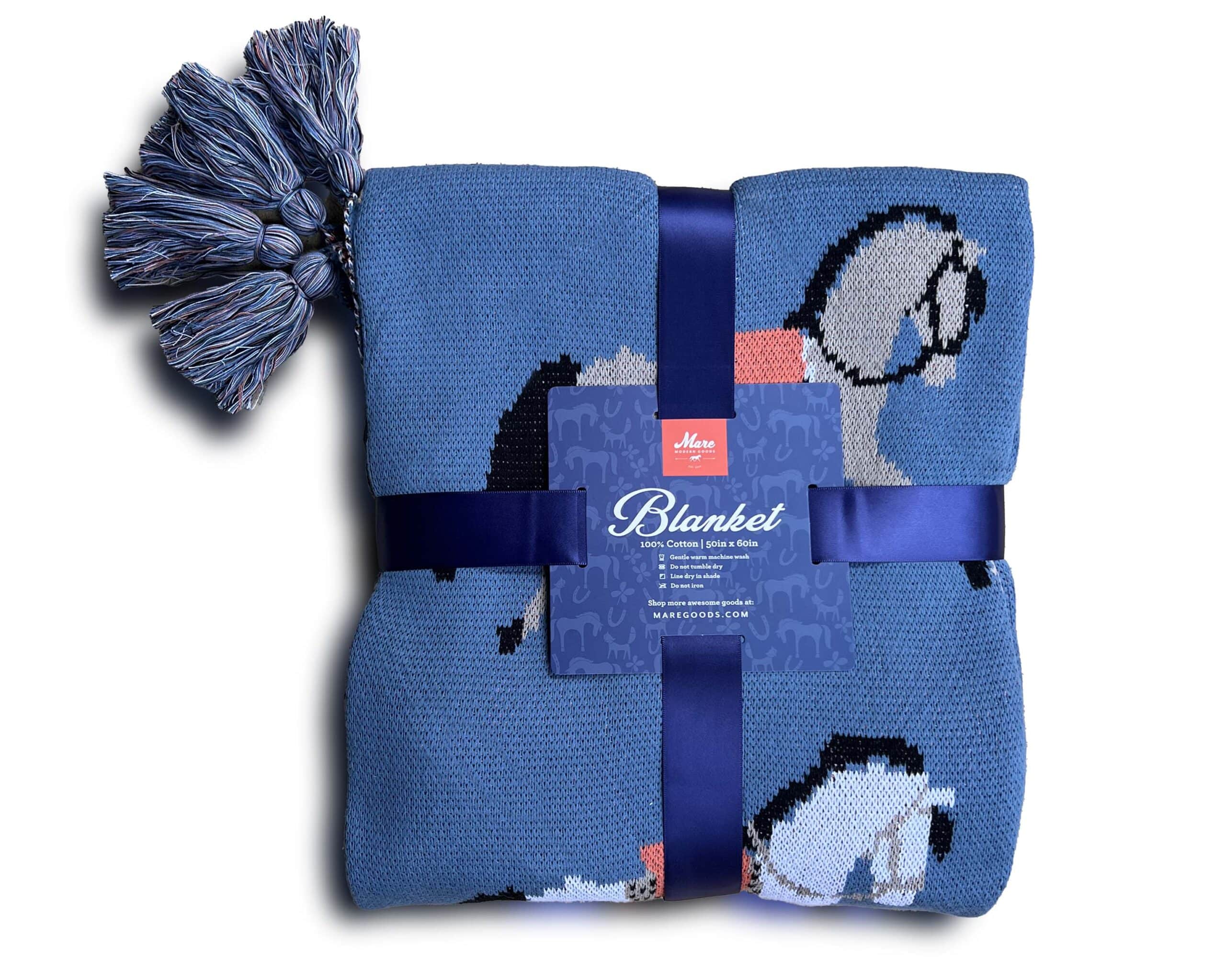 View of the folded Fancy Horses Mare Modern Goods Blanket on a white background