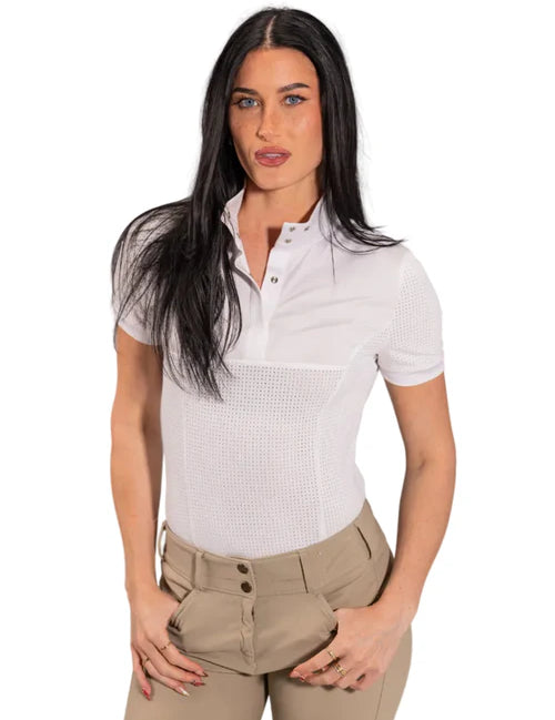 Woman wearing a white short-sleeve shirt with a patterned design and beige pants on a white background