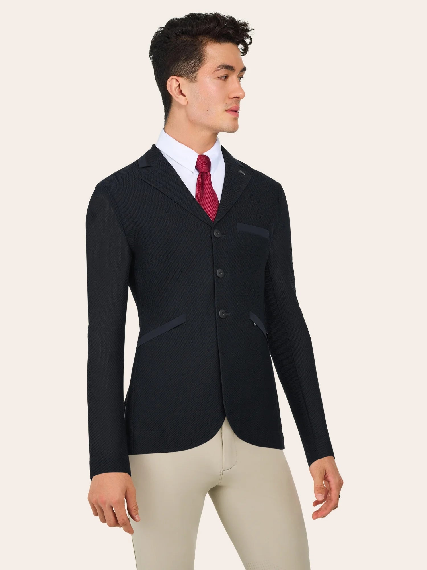 Angled front view of a male model wearing the Black RJ Classics Hudson Men's Mesh Coat on a plain background