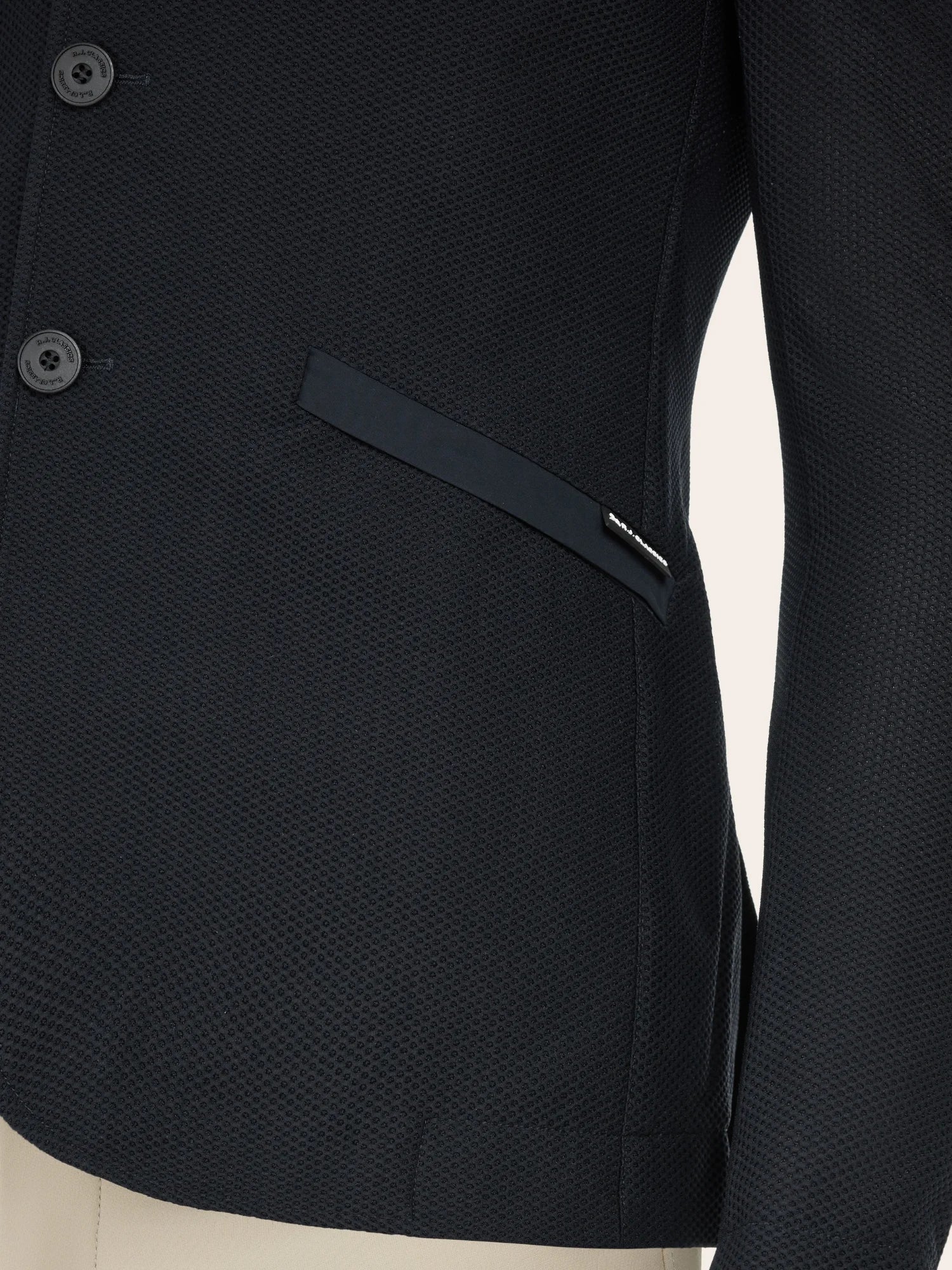 Close-up front view of the pocket on the Black RJ Classics Hudson Men's Mesh Coat on a plain background