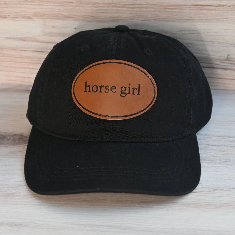 Front view of the Horse Girl Dubois Cheval Baseball Hat on a wood background