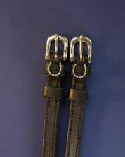 View of the Sparkly Horse Shoe Mane Jane Spur Straps  on a plain navy background