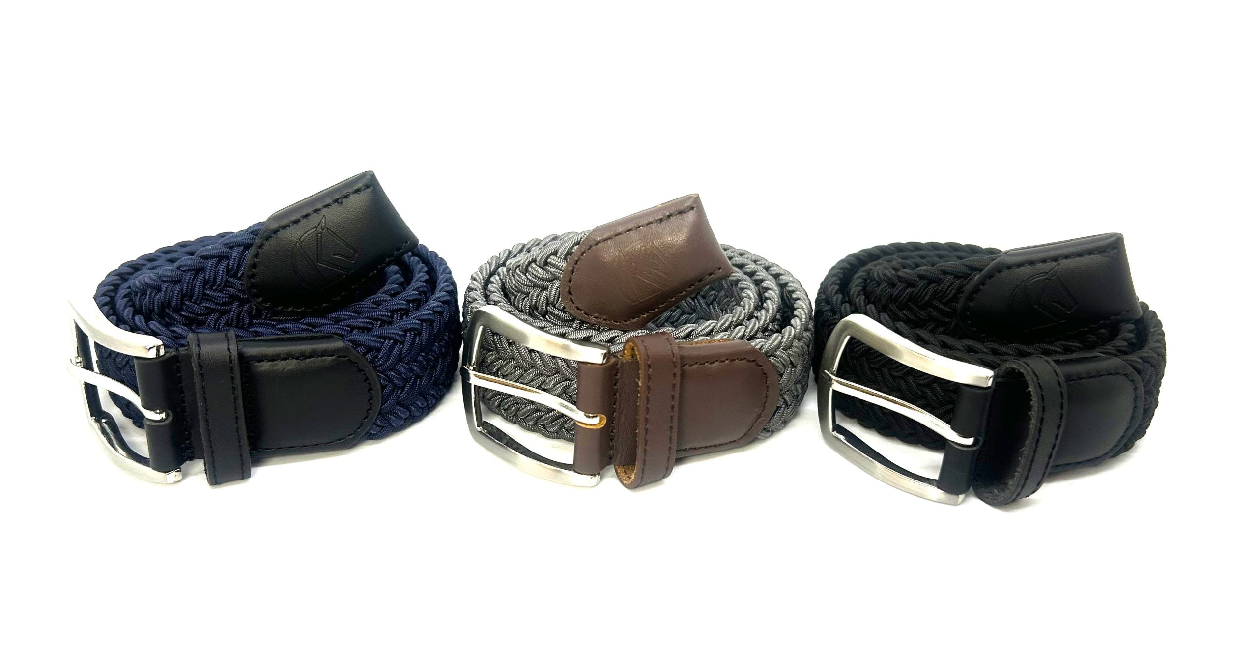 Side-by-side views of the the navy, grey, and black rolled up KL Select Silky Stretch Belts on a white background