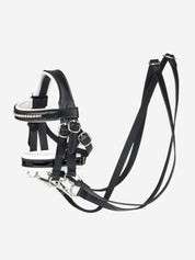 Side view of the Black Toy Pony Double Bridle on a plain background