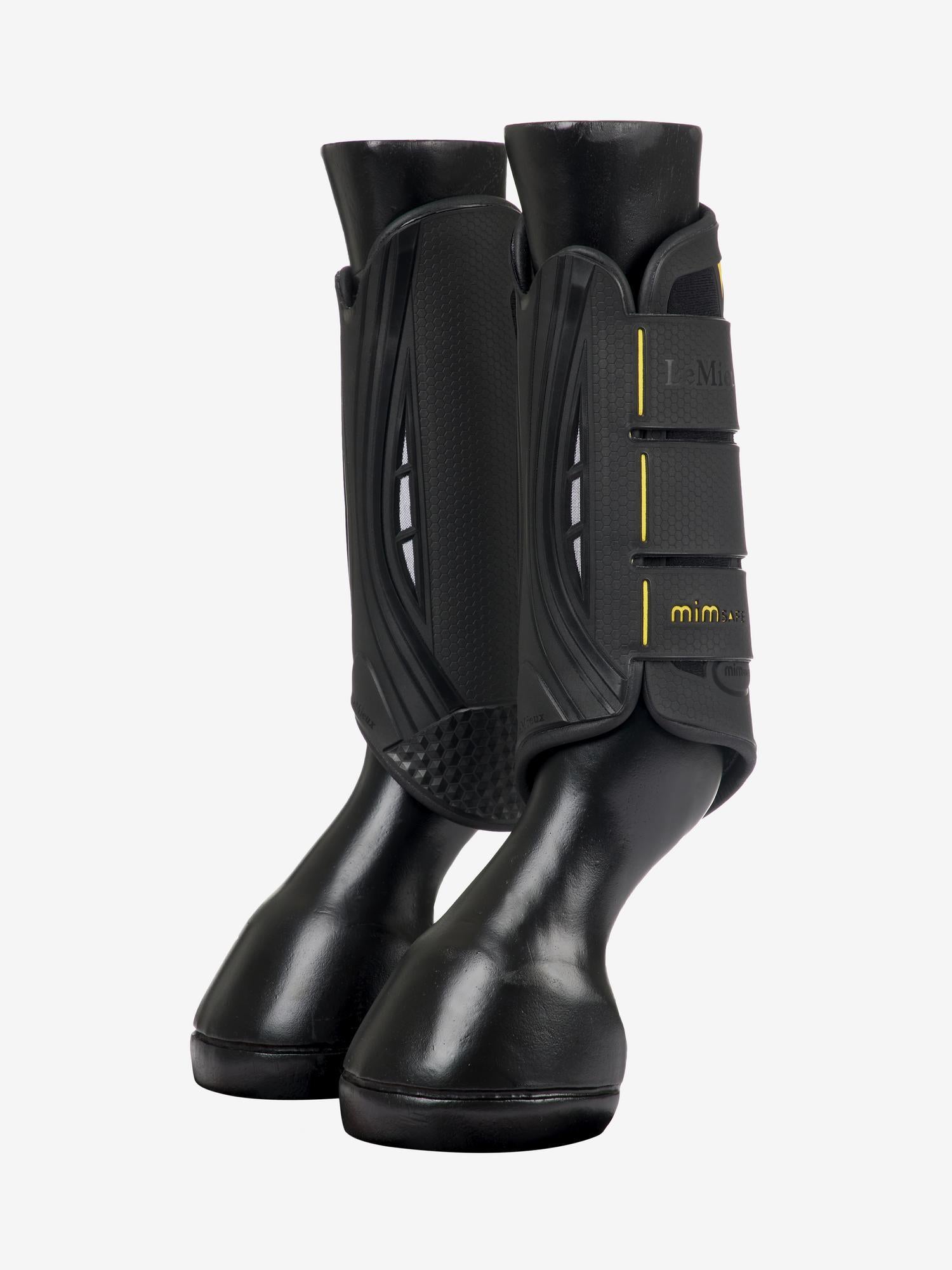 Side view of a pair of LeMieux MIMsafe XC Hind Boots on mannequin horse legs on a plain background