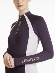 Angled front view of a female model wearing the Juniper LeMieux Philippa Mesh Base Layer on a plain background