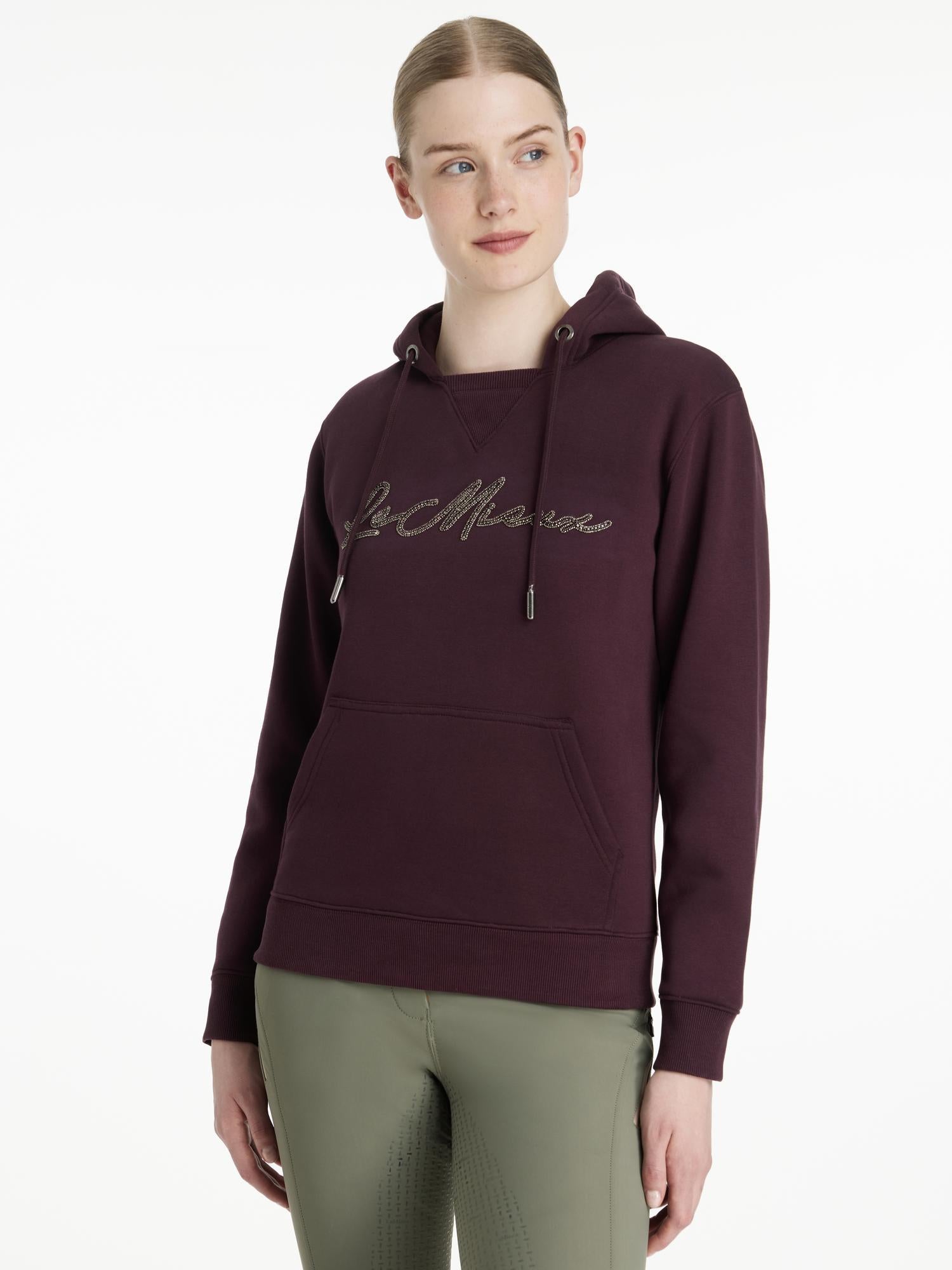 Front view of a female model wearing the Damson LeMieux Elspeth Hoodie on a plain background