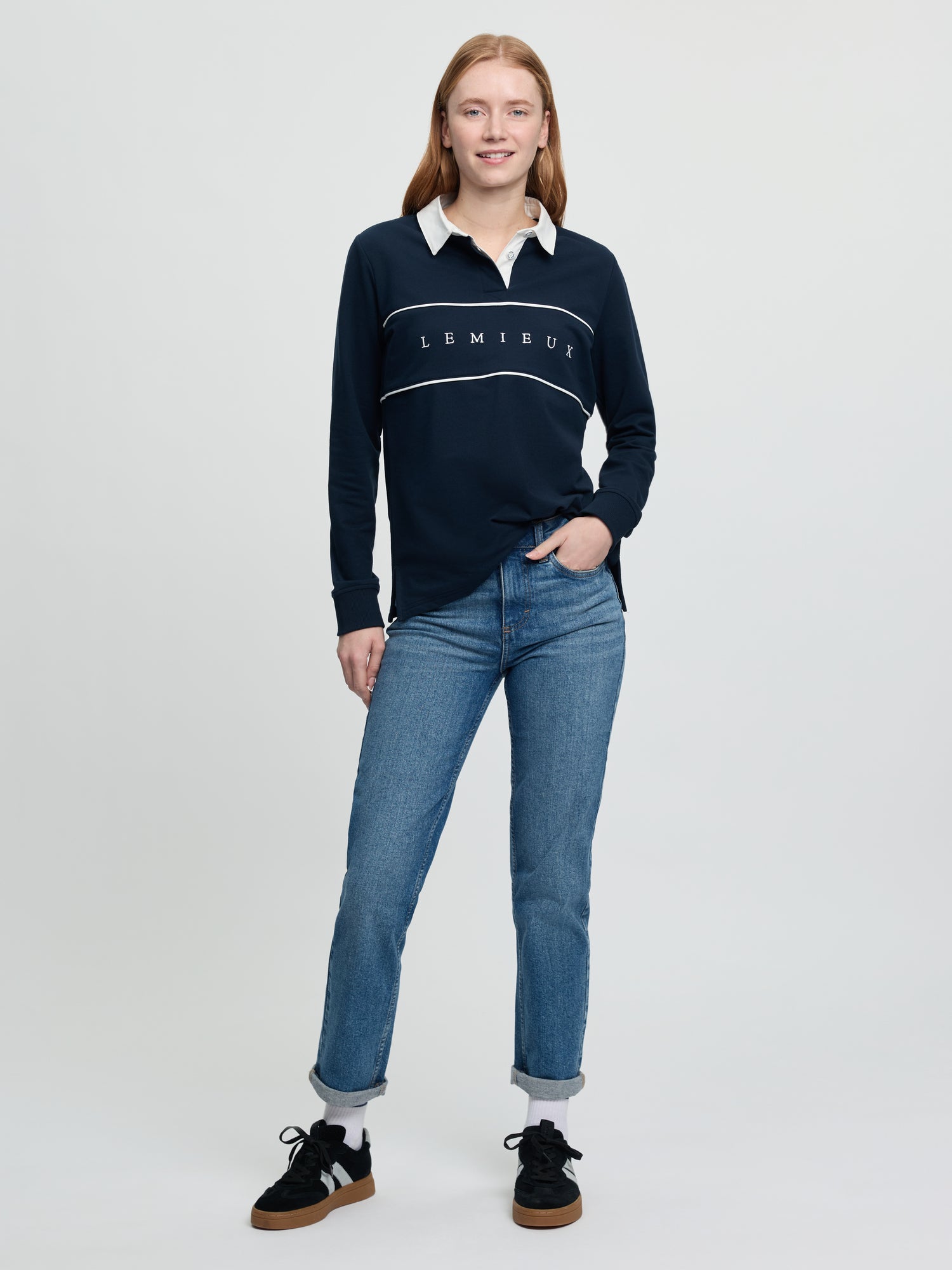 Full-length view of navy Rochelle Rugby Shirt with white collar and chest piping.