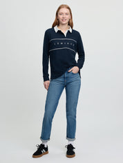 Full-length view of navy Rochelle Rugby Shirt with white collar and chest piping.