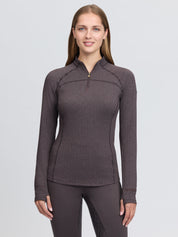 Front view of a female model wearing the Cocoa LeMieux Heritage Herringbone Base Layer on a plain background