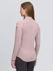 Back view of a female model wearing the Wild Rose LeMieux Heritage Herringbone Base Layer on a plain background