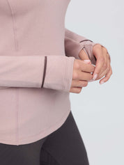 View of the sleeve cuffs on the Wild Rose LeMieux Heritage Herringbone Base Layer on a plain background